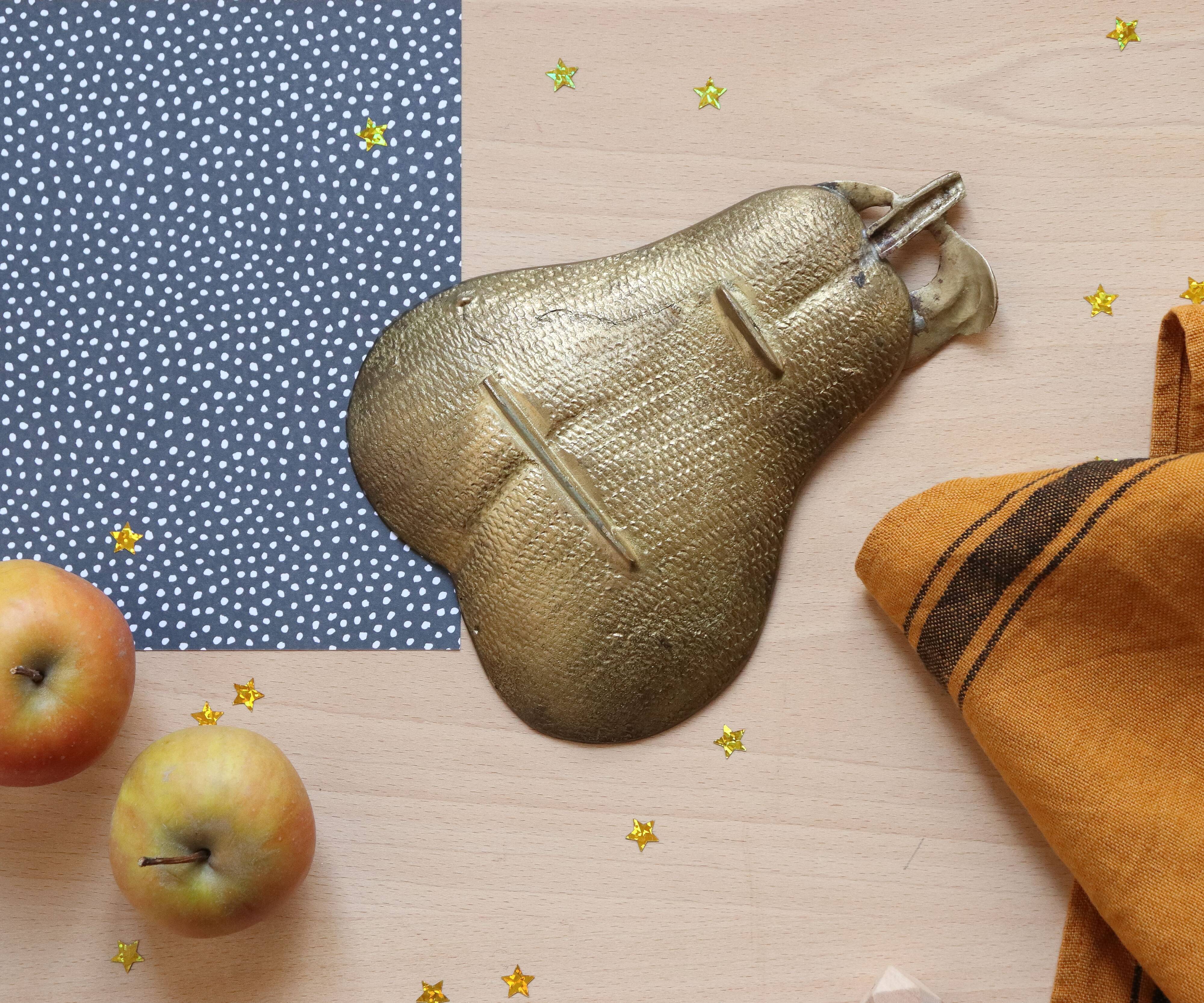 1960s gold-plated brass pear-shaped pocket emptier