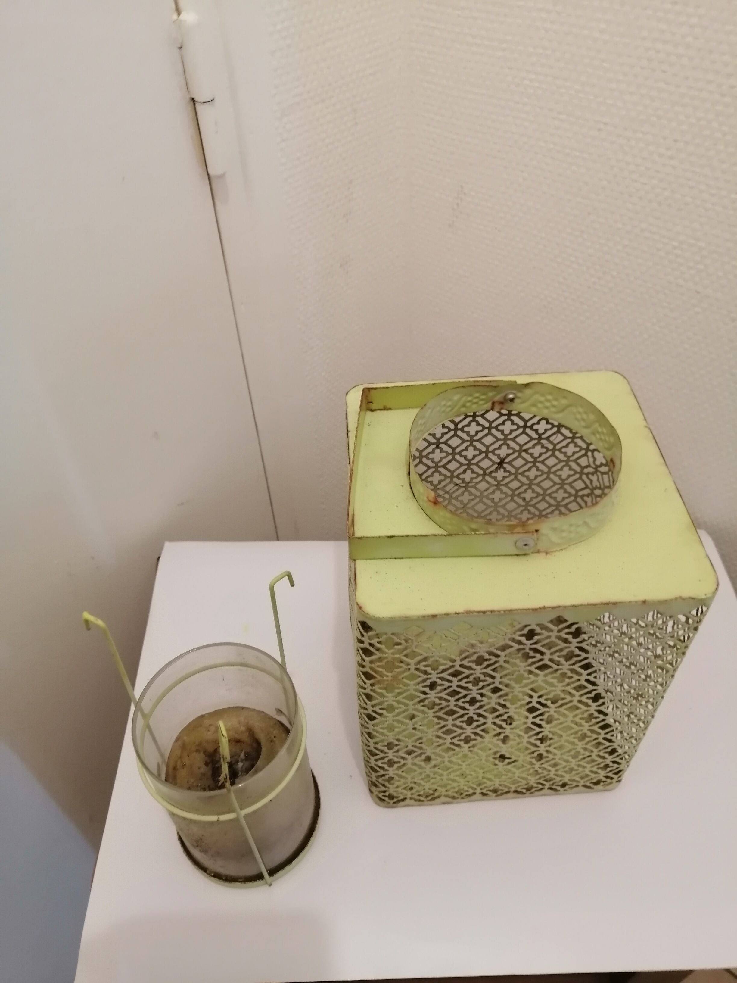 Metal lanterns with garden candles