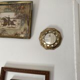 Antique mirror in worked brass