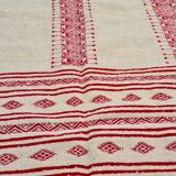 Traditional ethnic-patterned red and white carpet