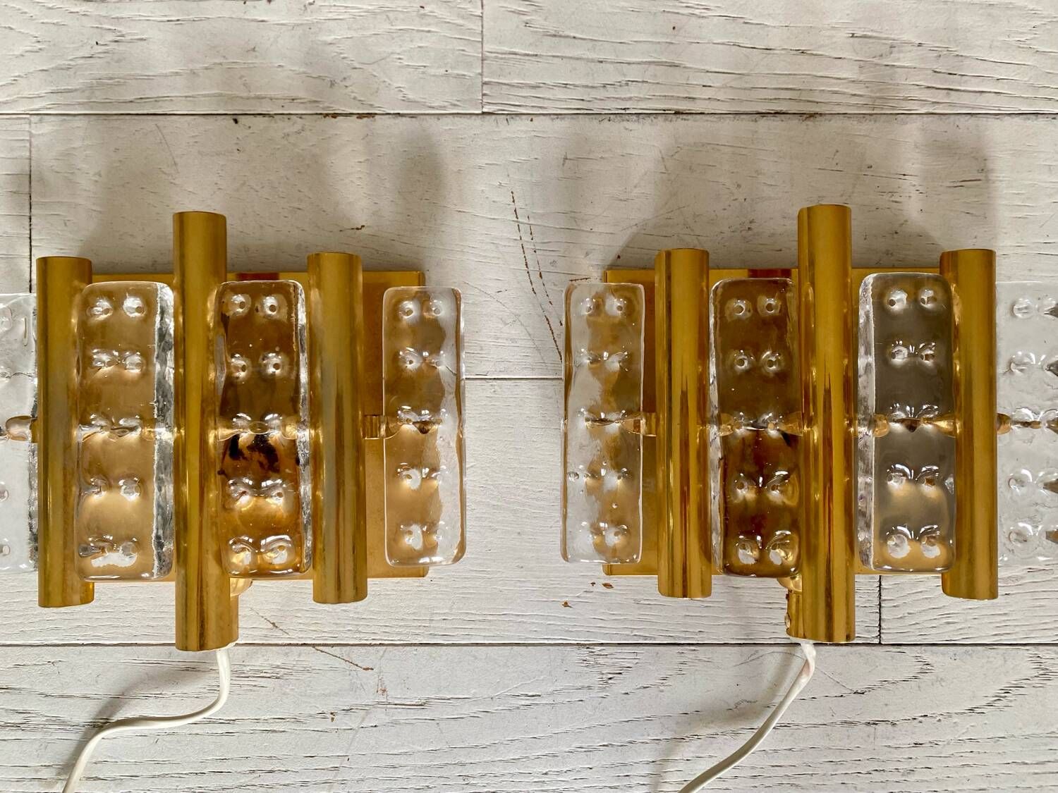 HANS AGNE JAKOBSSON. A pair of glass and brass wall lights