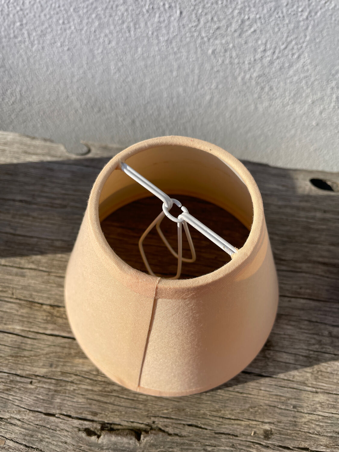 Small cracked white ceramic lamp with flowers.