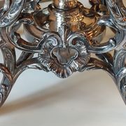Ancient samovar tea fountain in silver metal