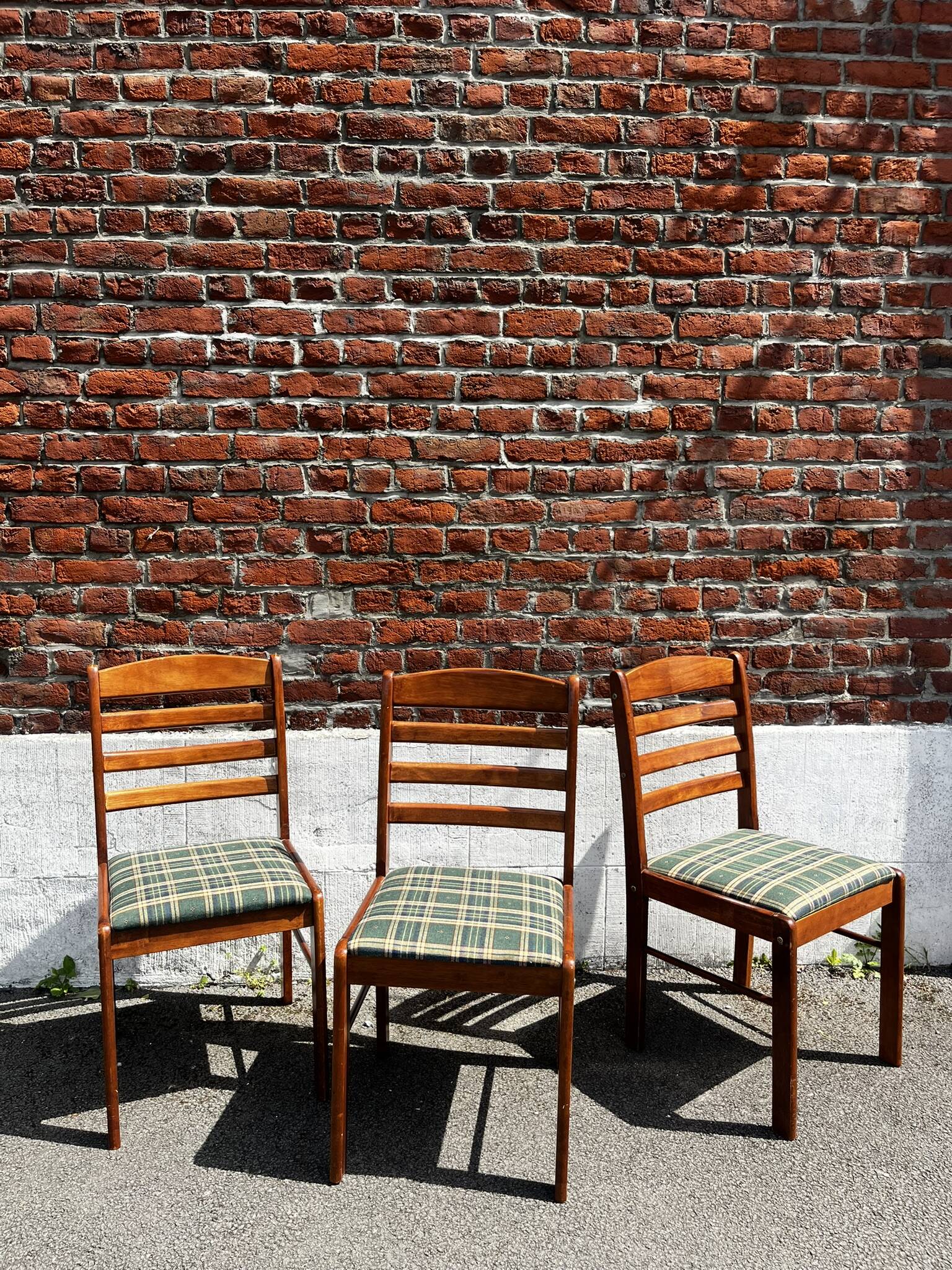 Lot of 3 vintage checkered wood and fabric chairs.