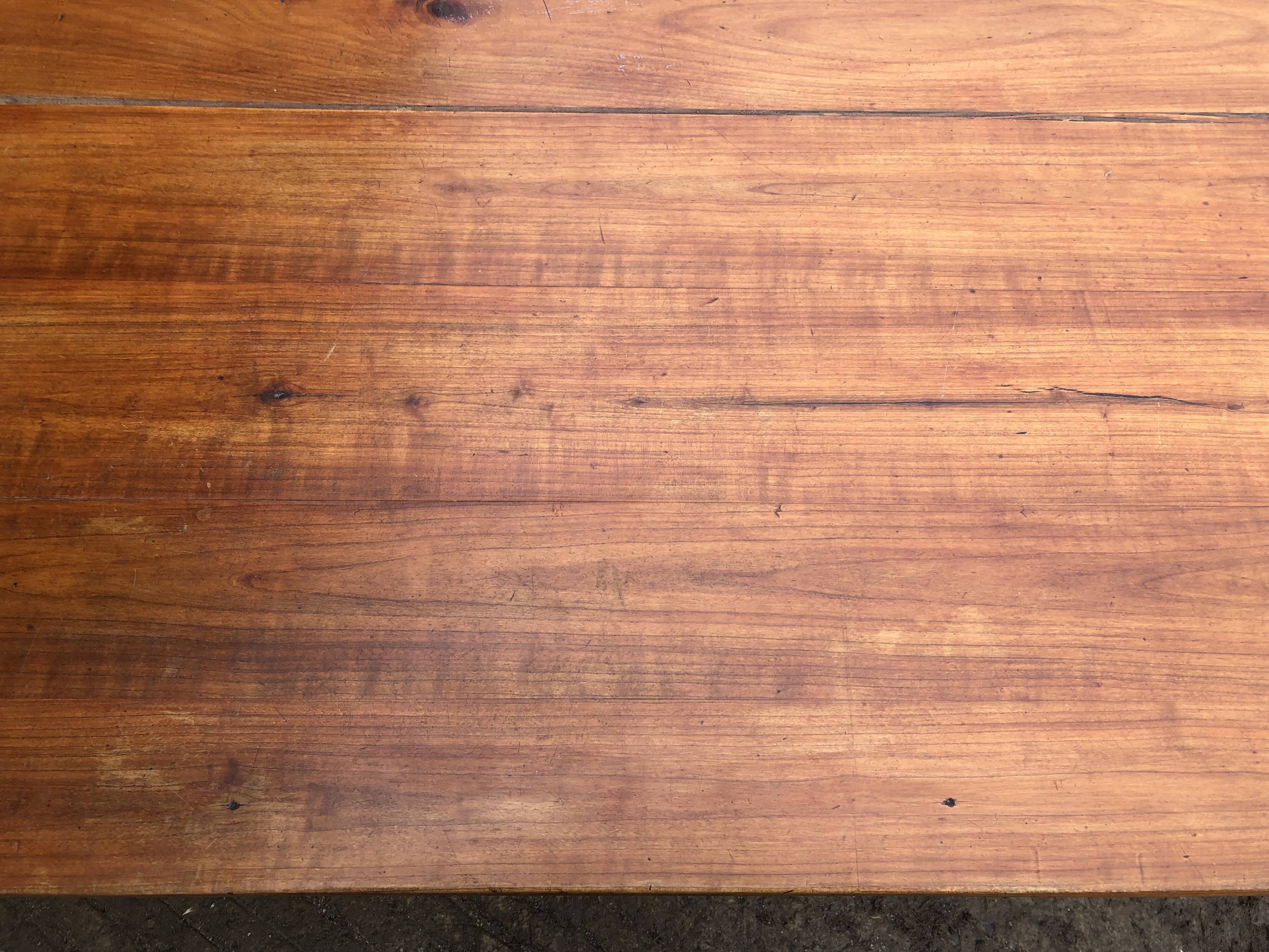 Antique farmhouse table in solid cherry wood with 3 drawers and 1 pull-out.