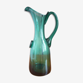 Pitcher made of green glass blown and tinted in the mass