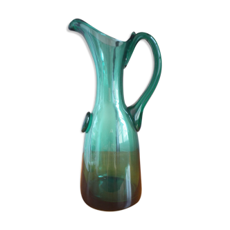 Pitcher made of green glass blown and tinted in the mass