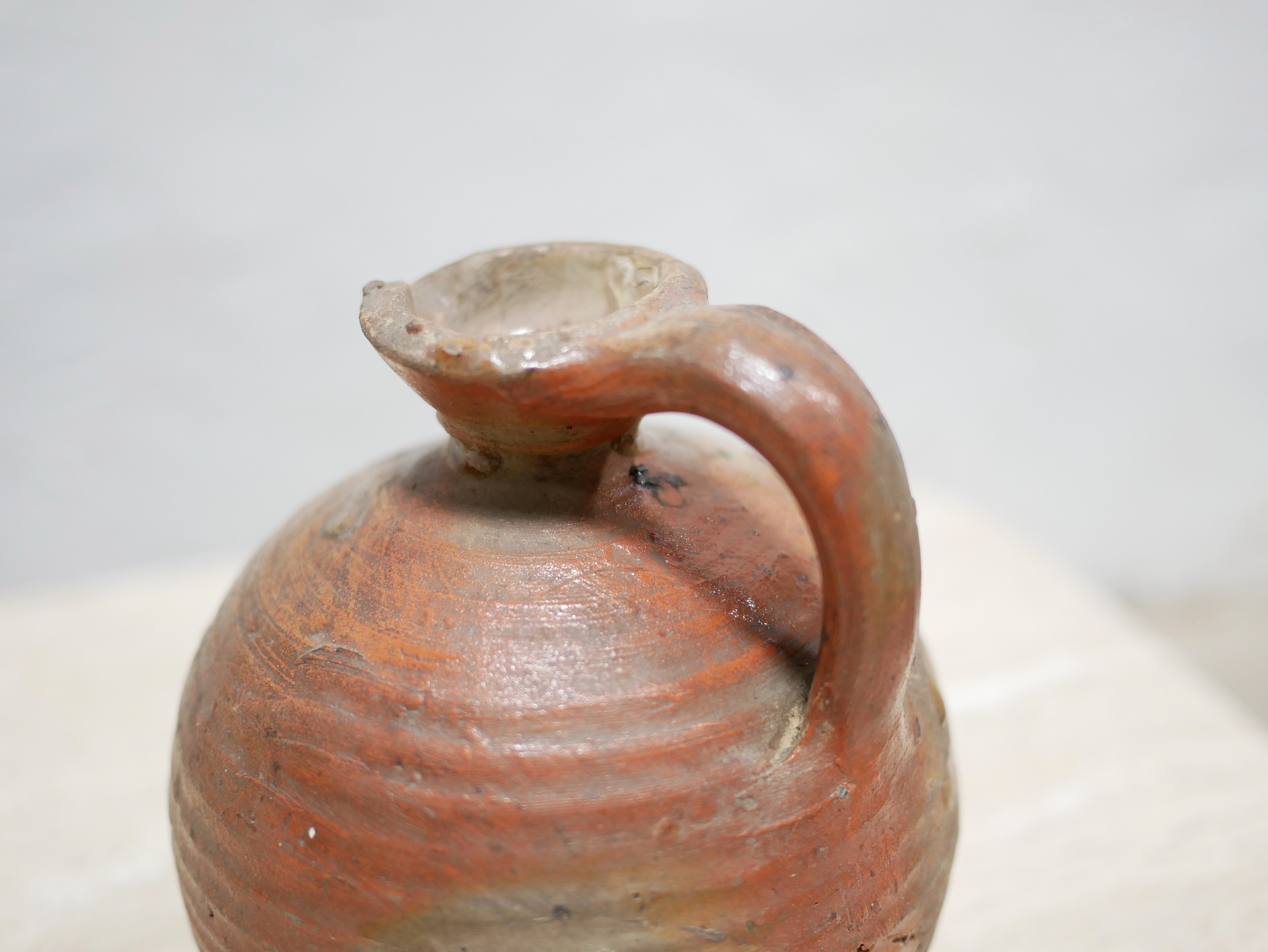 Old glazed terracotta jar