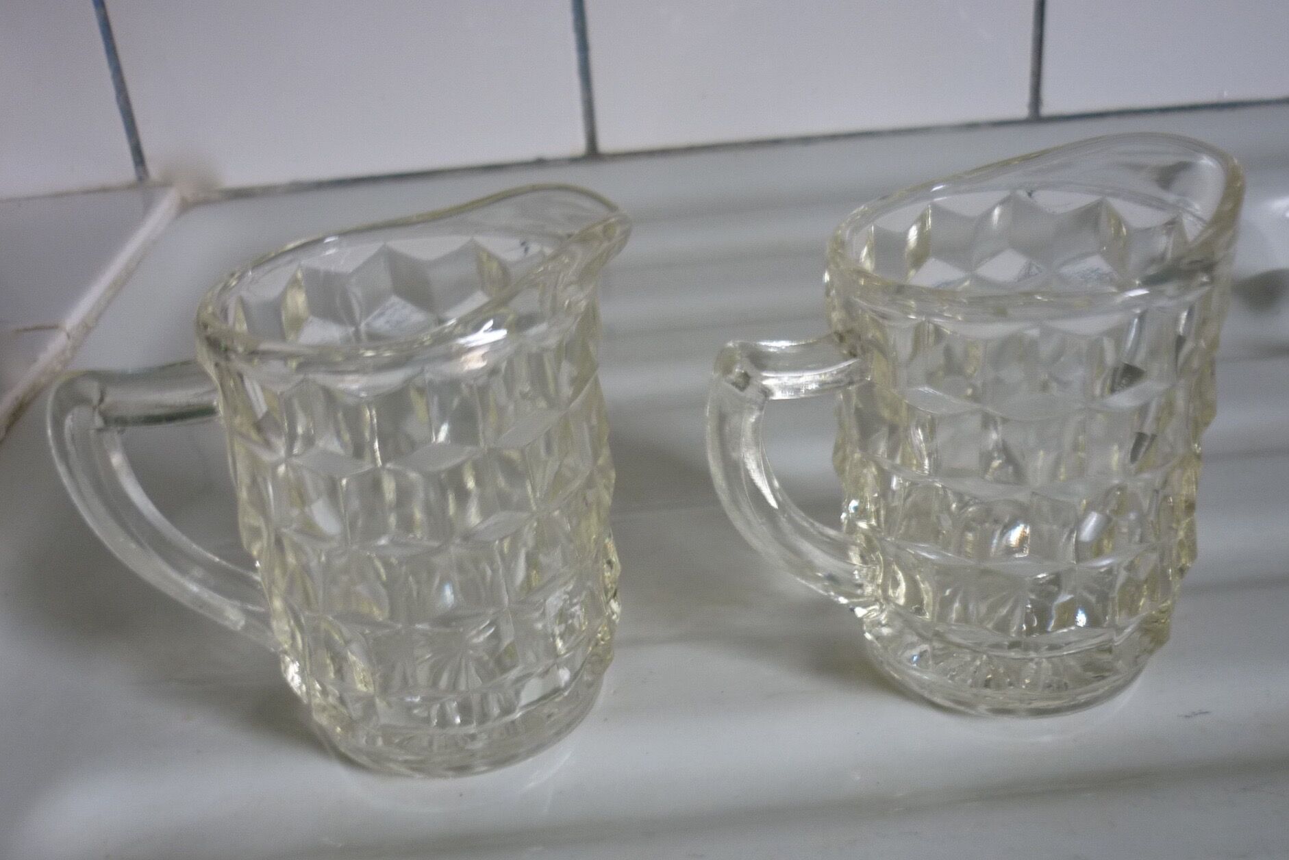 Lot of milk pots or moulded glass cream jars