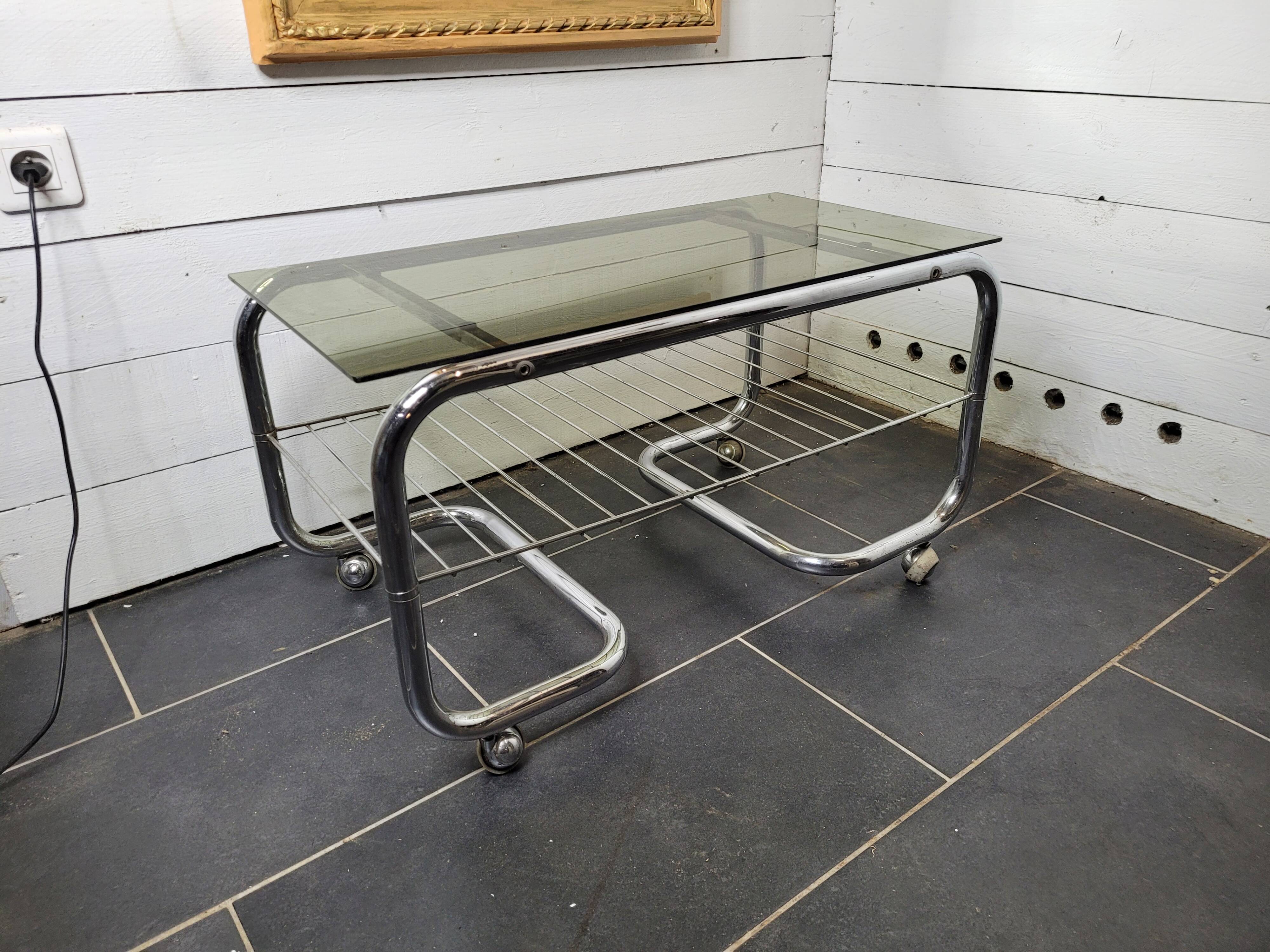 Coffee table with chrome base and smoked glass from the 70s