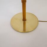 Mid-century floor lamp in brass and oak by Falkenbergs Belysning, Sweden, 1960s.