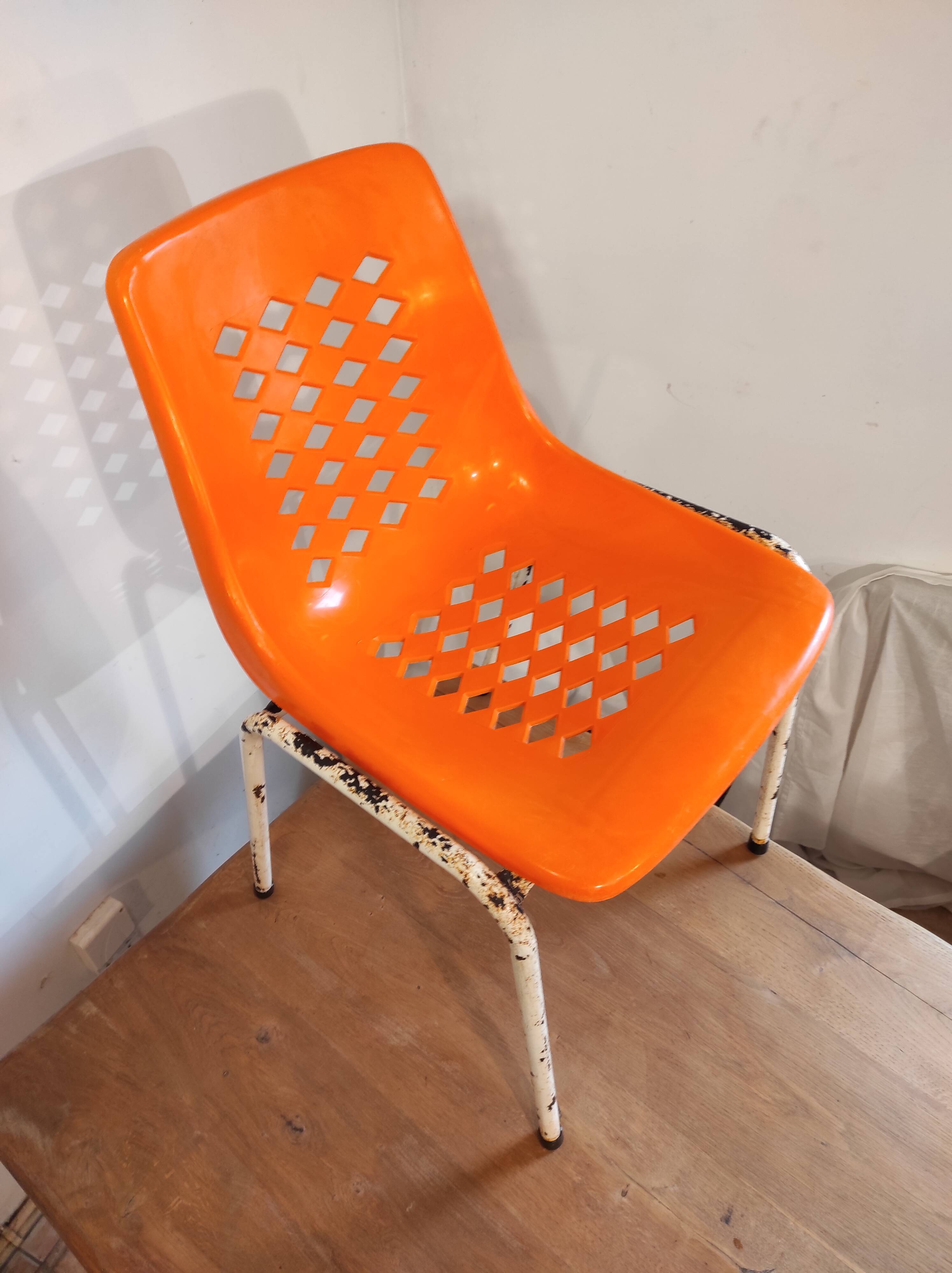 Chair with openwork plastic shell 1970
