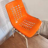 Chair with openwork plastic shell 1970