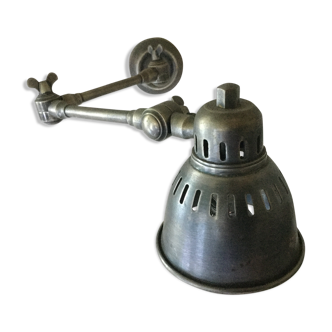 Orientable arm sconce