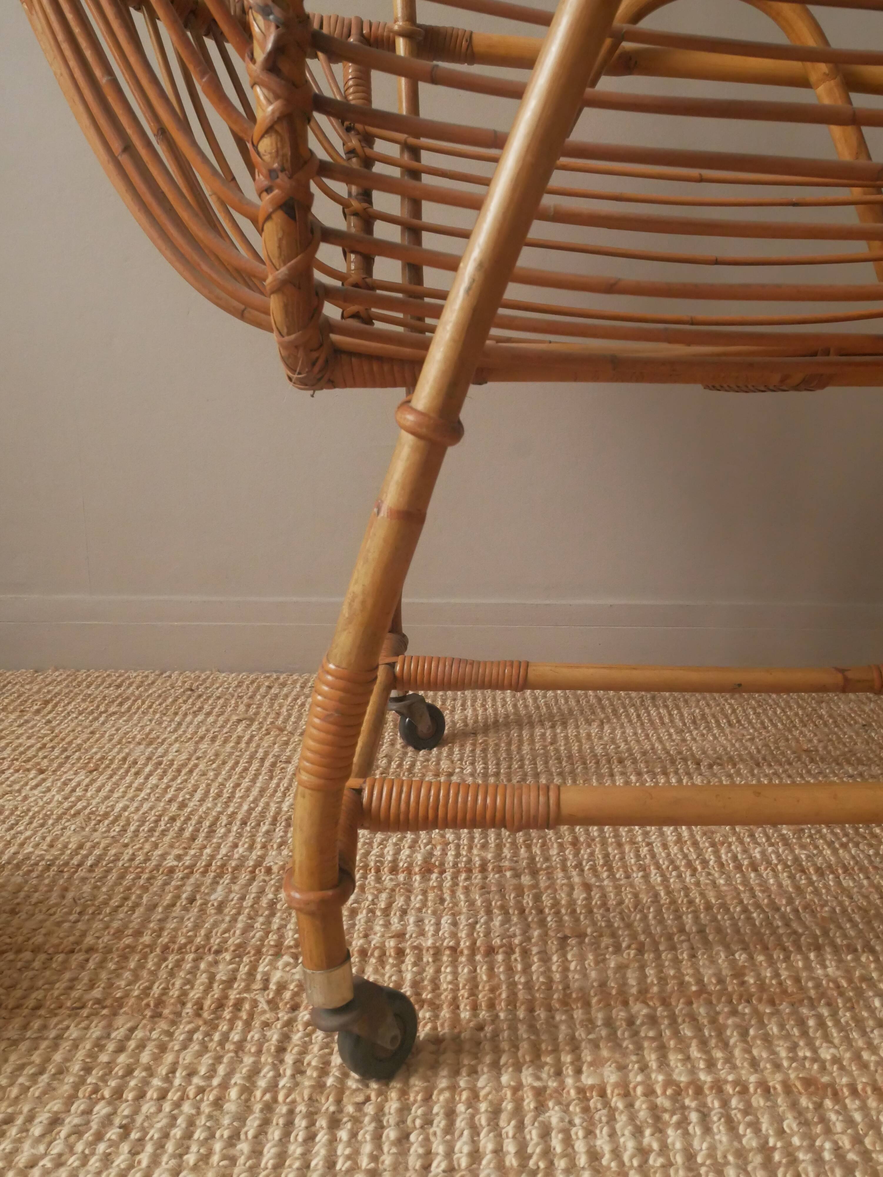 Vintage rattan cradle bassinet on wheels retro Scandinavian design baby bed