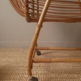 Vintage rattan cradle bassinet on wheels retro Scandinavian design baby bed