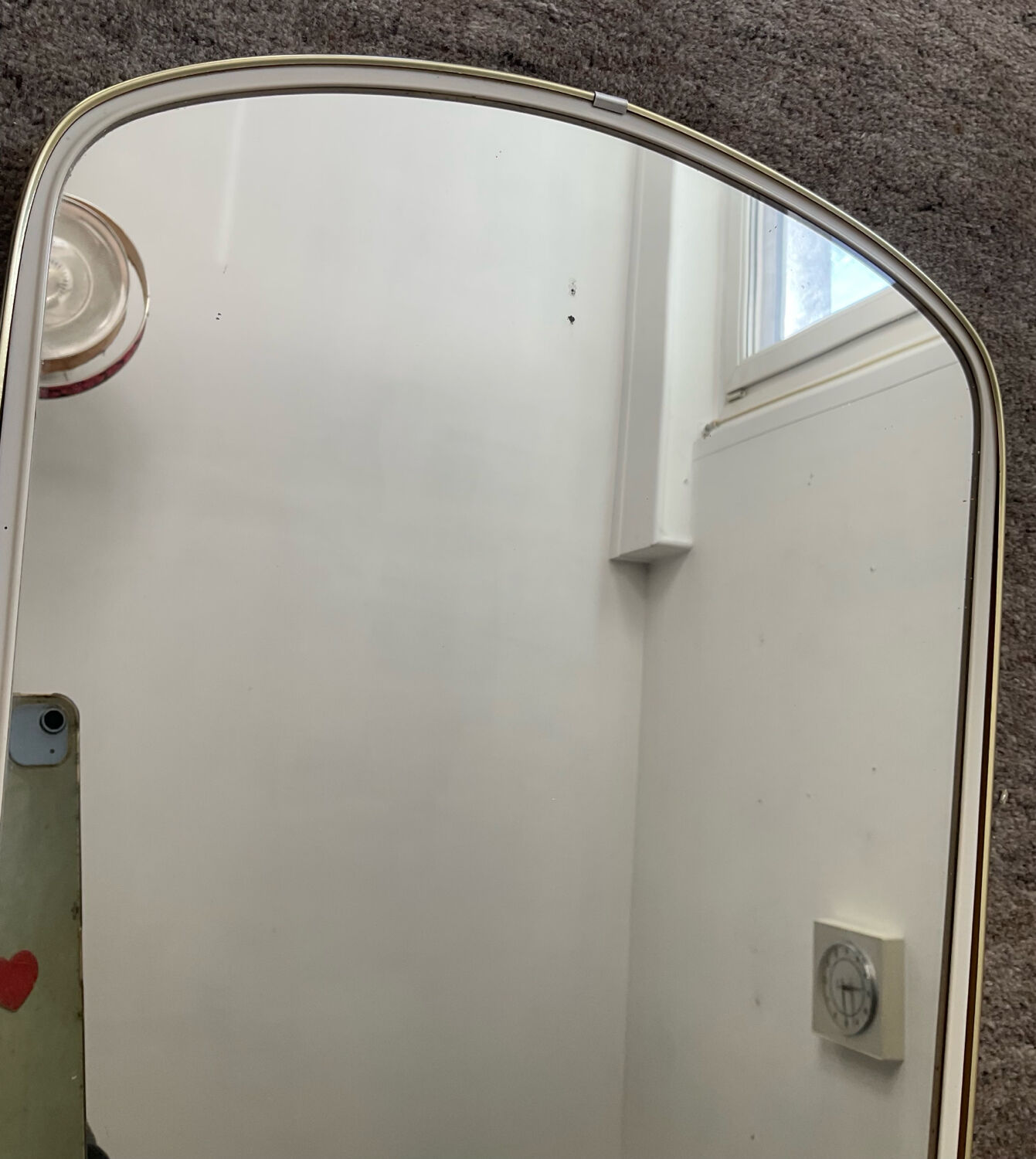 Asymmetrical free-form mirror from the 60s-70s.