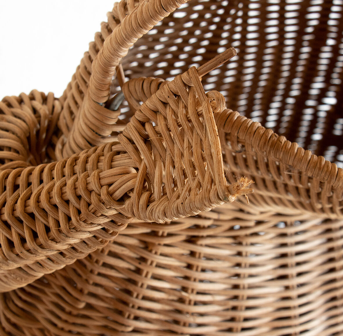 Wicker and braided rattan magazine door by Olivier Cajan