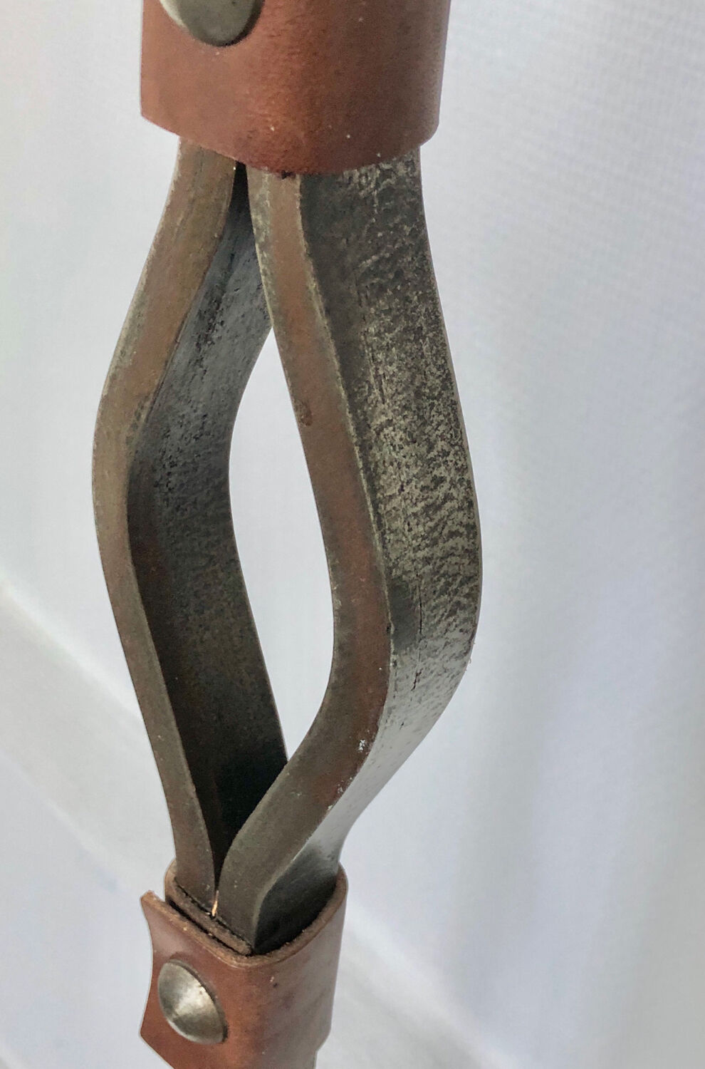 Hammered wrought iron and leather floor lamp by Jean Pierre Rickaert, 1950s