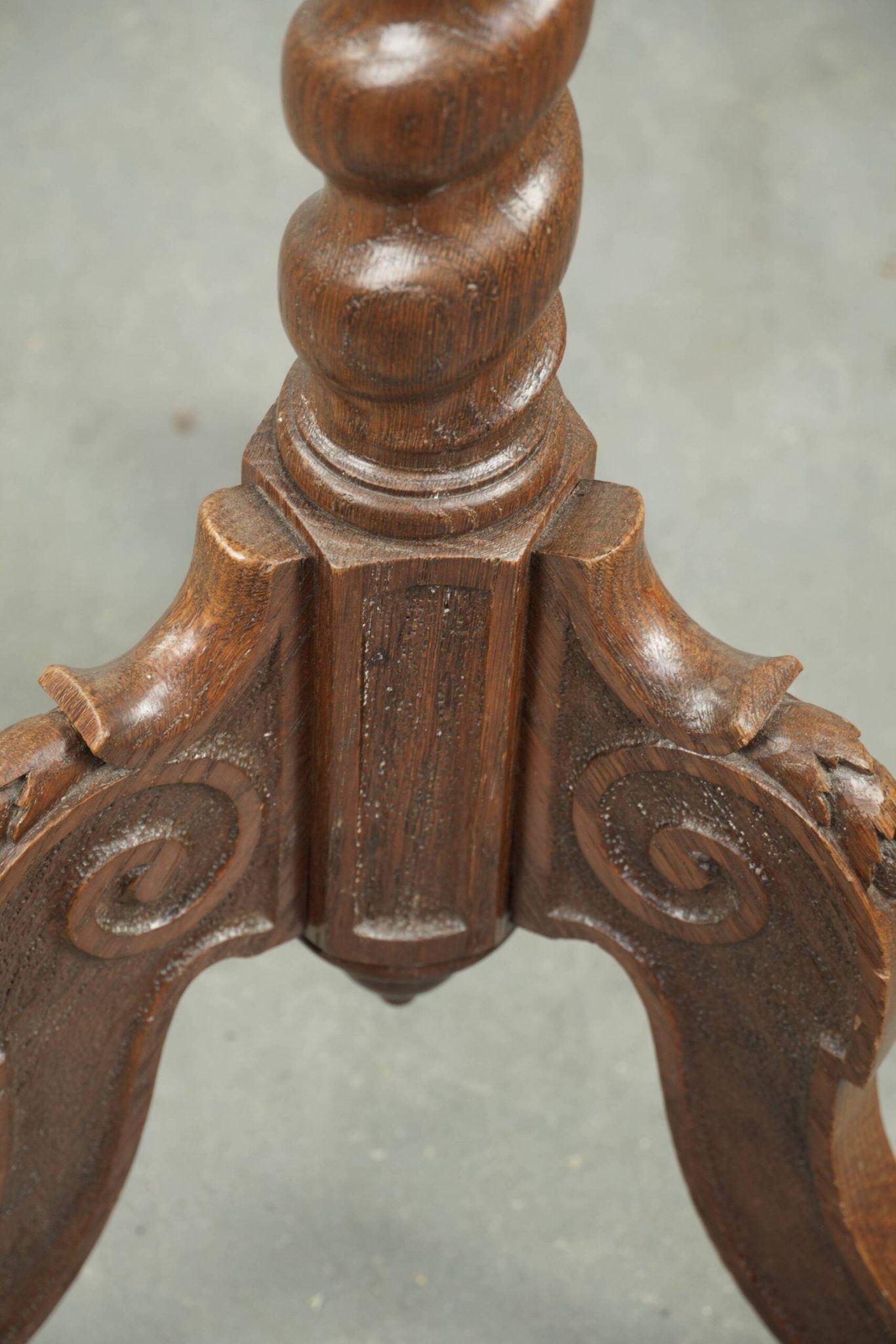 Antique tall oak plant/side table with wood carving and a turned leg