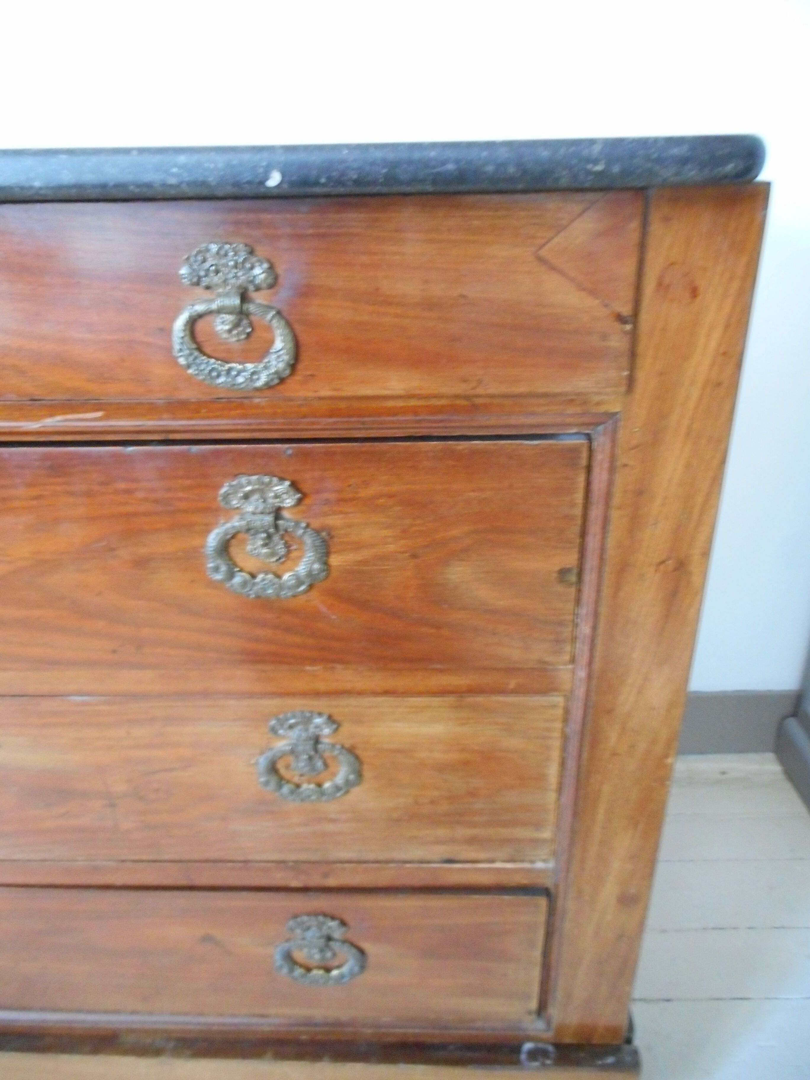 Old chest of drawers with black marble