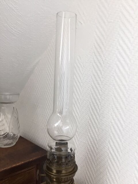 Old-fashioned brass standing oil lamp