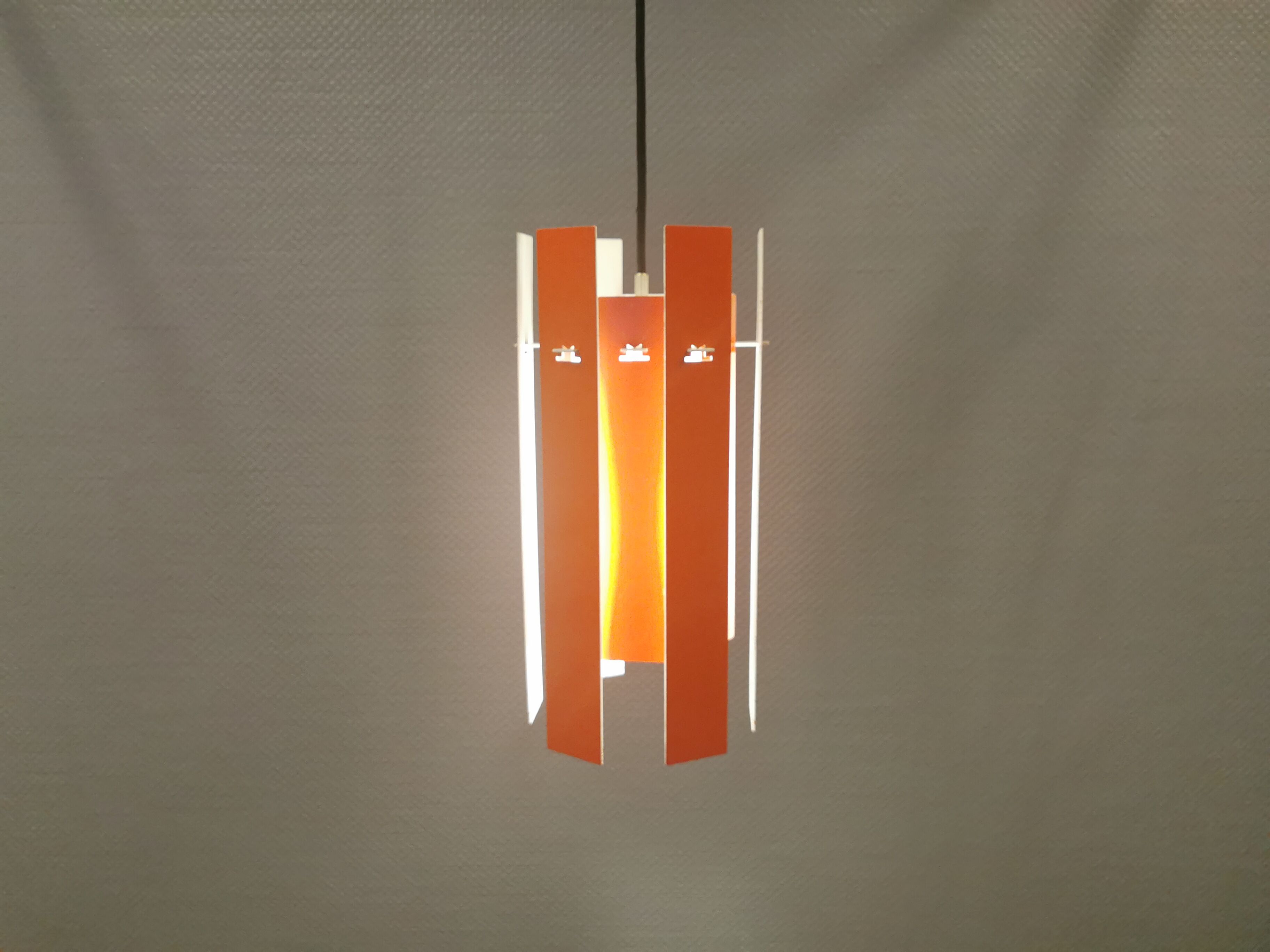 Danish hanging lamp model "Cocktail" consisting of 12 red/white aluminium slats