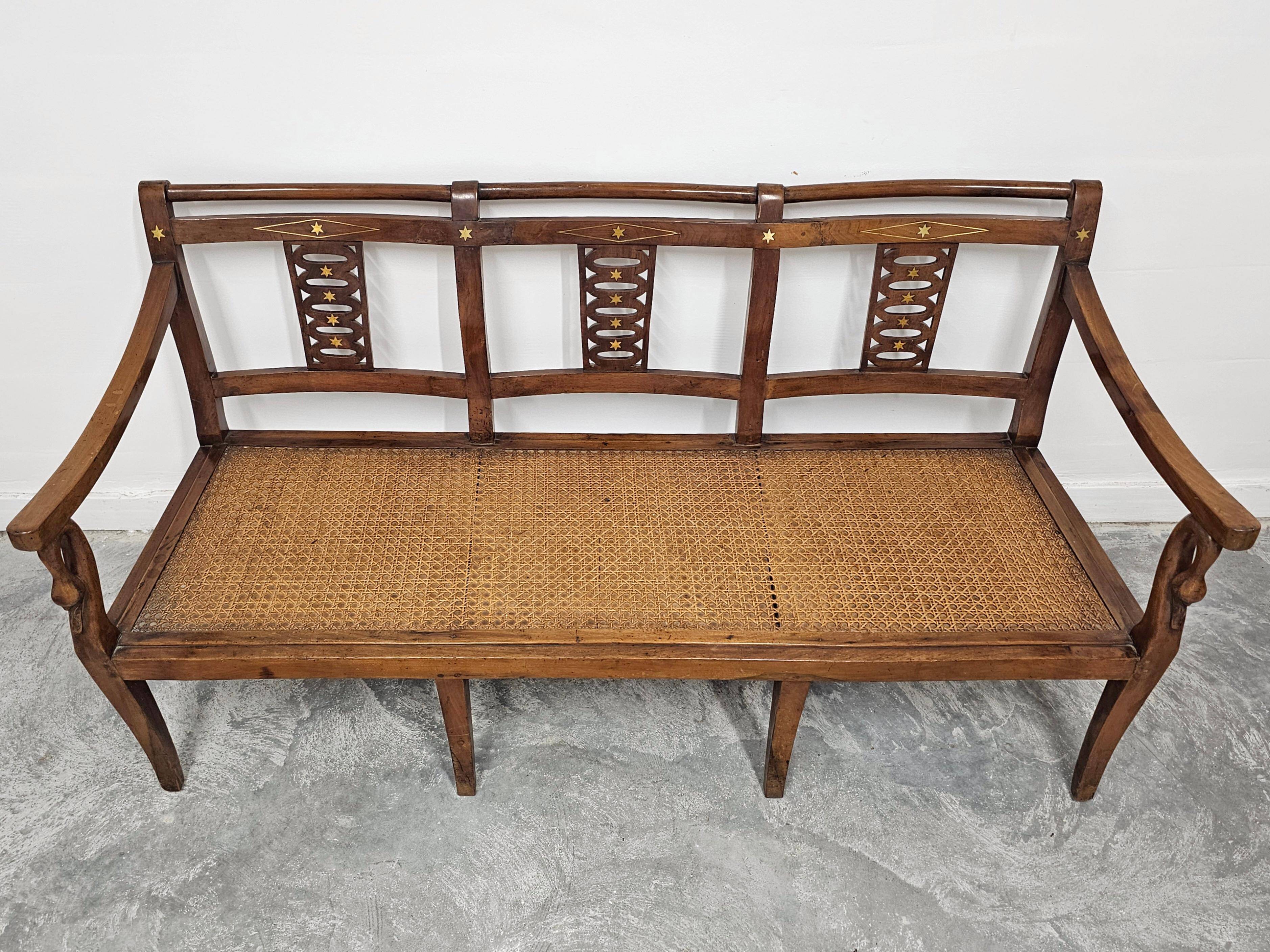 Directoire canapé in walnut with brass inlays, late 18th century.