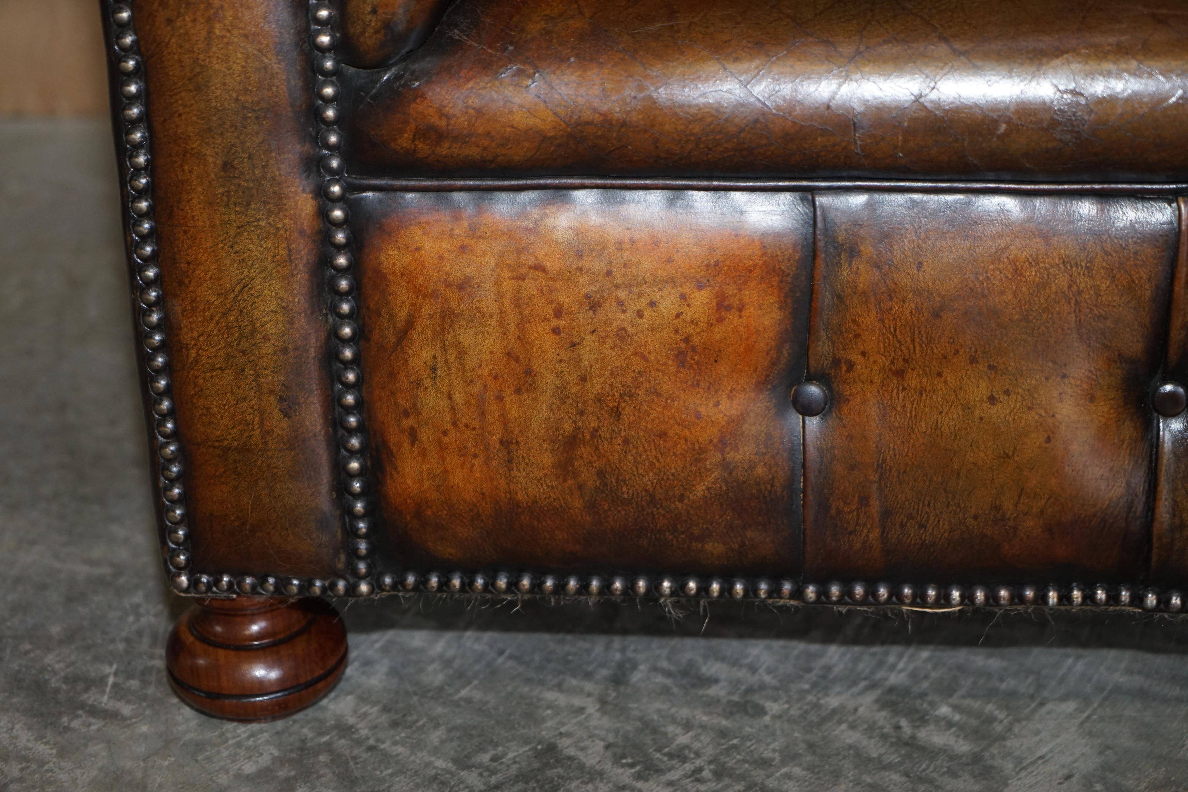 Restored leather Chesterfield sofa, walnut legs.