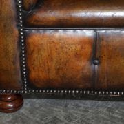 Restored leather Chesterfield sofa, walnut legs.