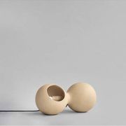 Table lamp or wall lamp in sand color made of ceramic, contemporary work.