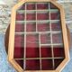 Old hanging showcase 22 wooden boxes red background