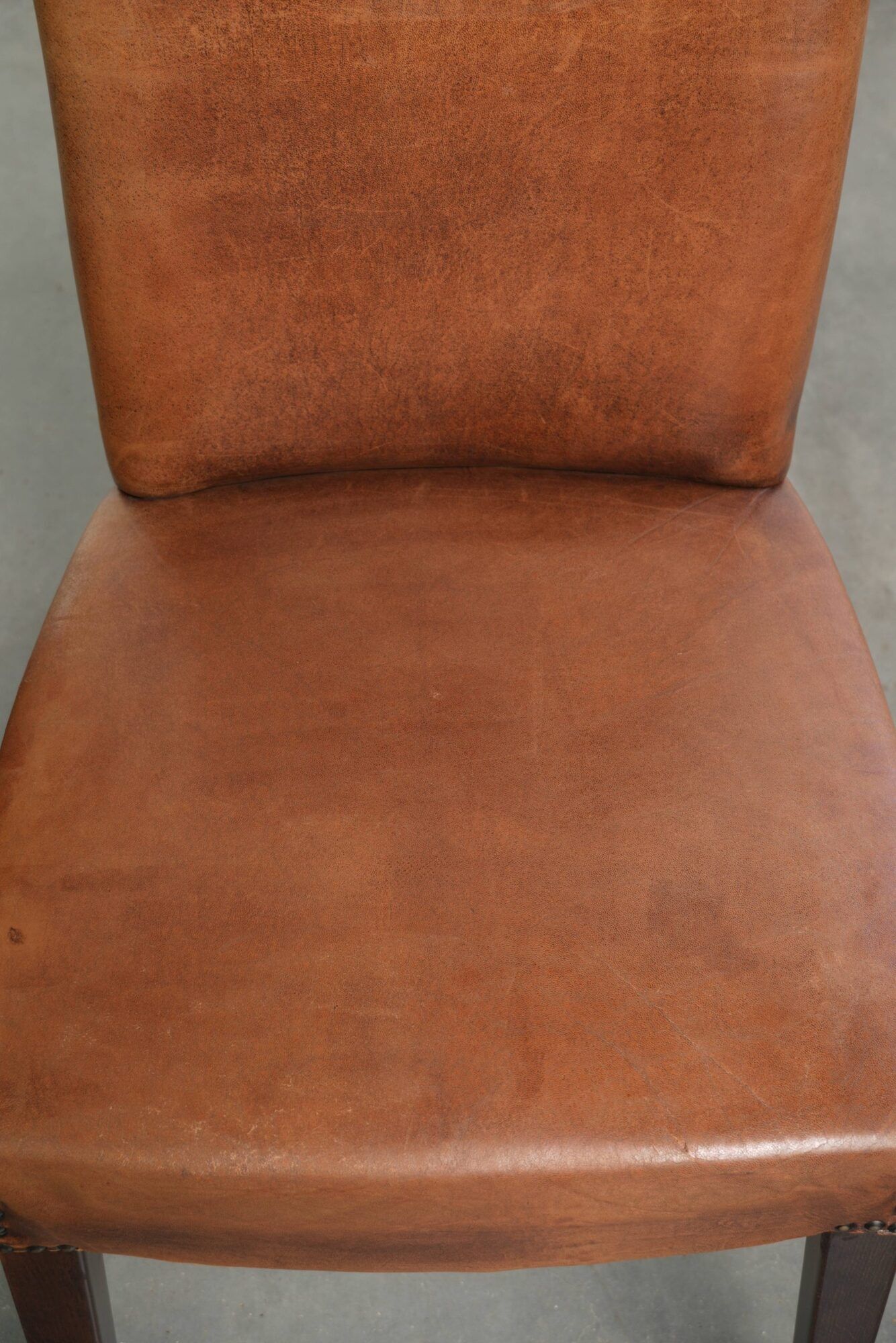 Set of 6 sheepskin dining chairs in a cognac colour with a lovely patina