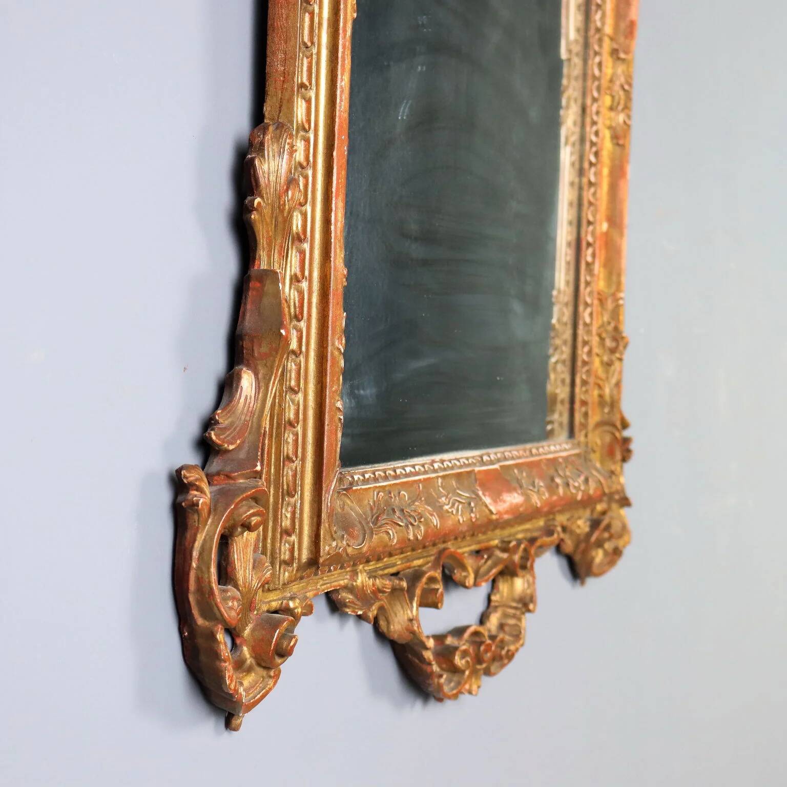 Antique carved and gilded wooden mirror, Italy, early 20th century.