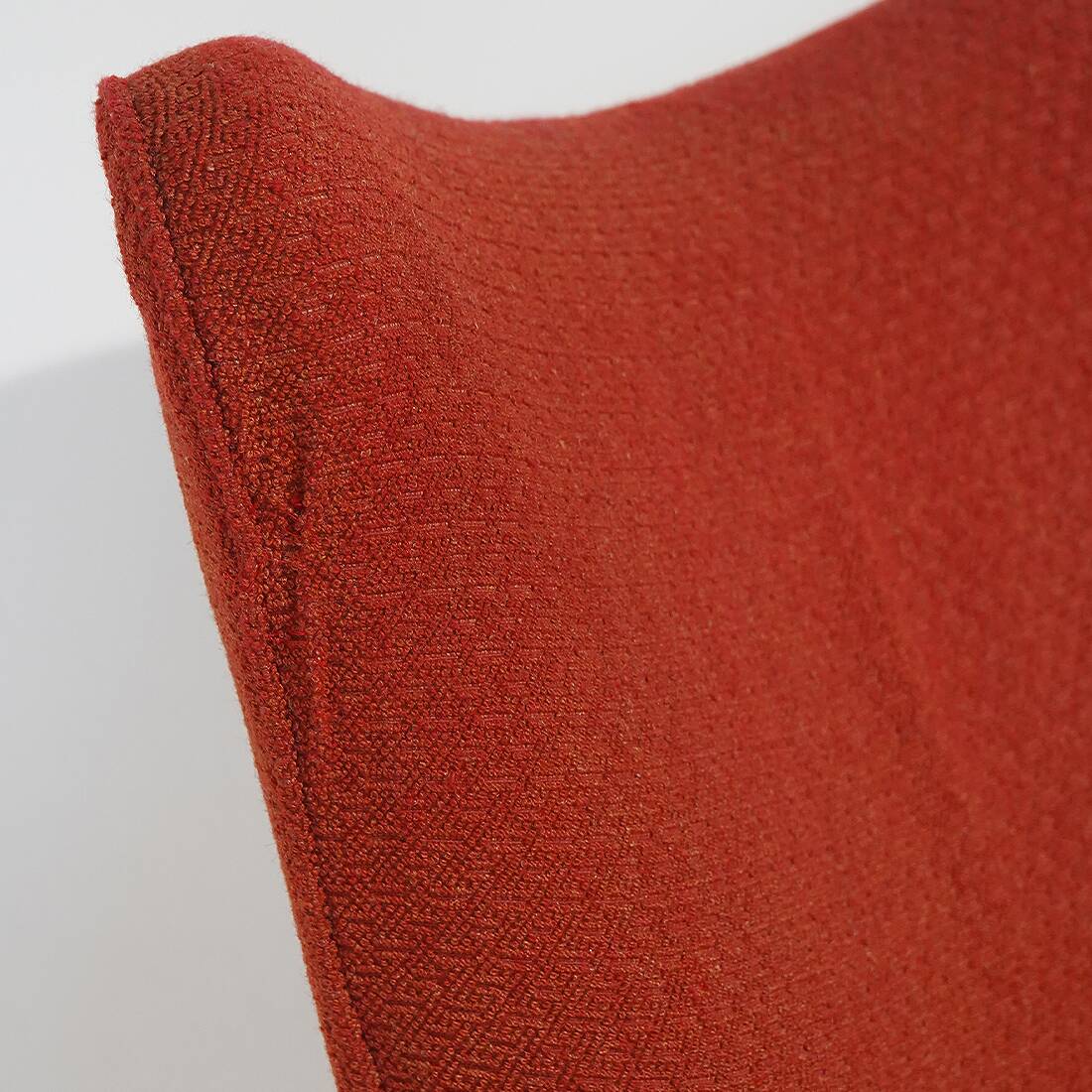 Pair of red armchairs with cone-shaped feet, 1950s