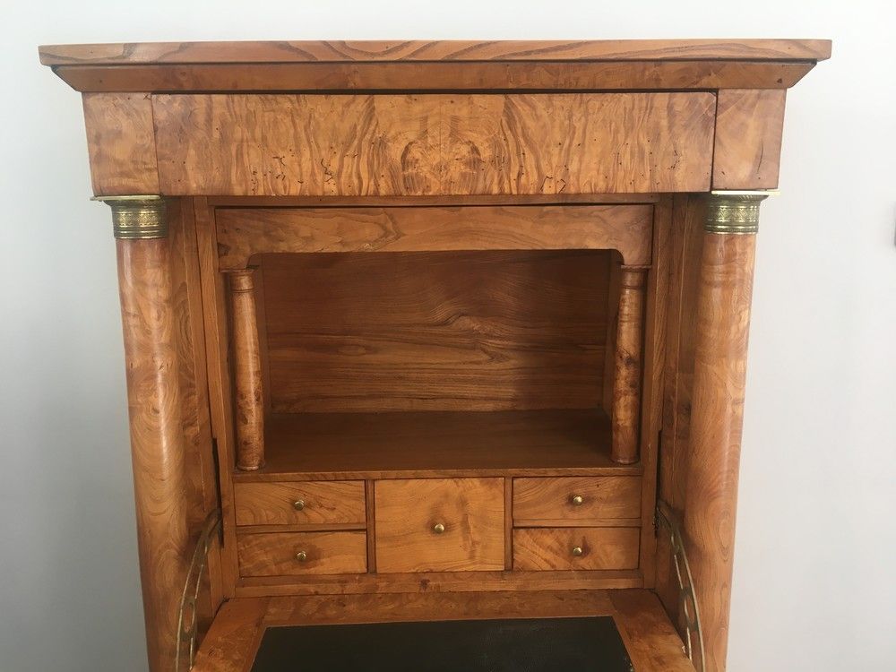 Empire-style secretary desk in burr walnut with detached columns, drop-front, and secret drawer