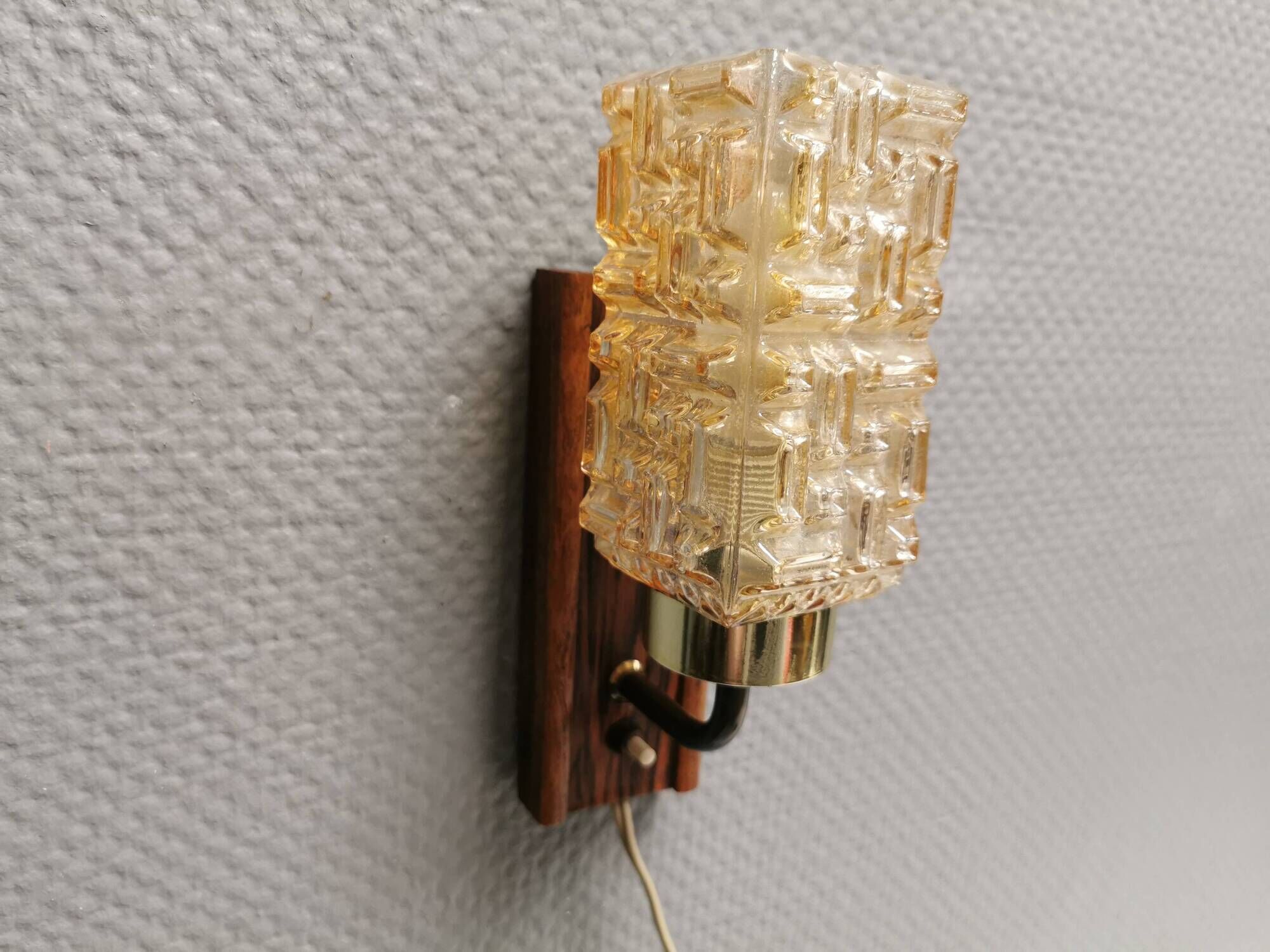 Small, stylish wall lamp with rosewood suspension and hard pressed glass