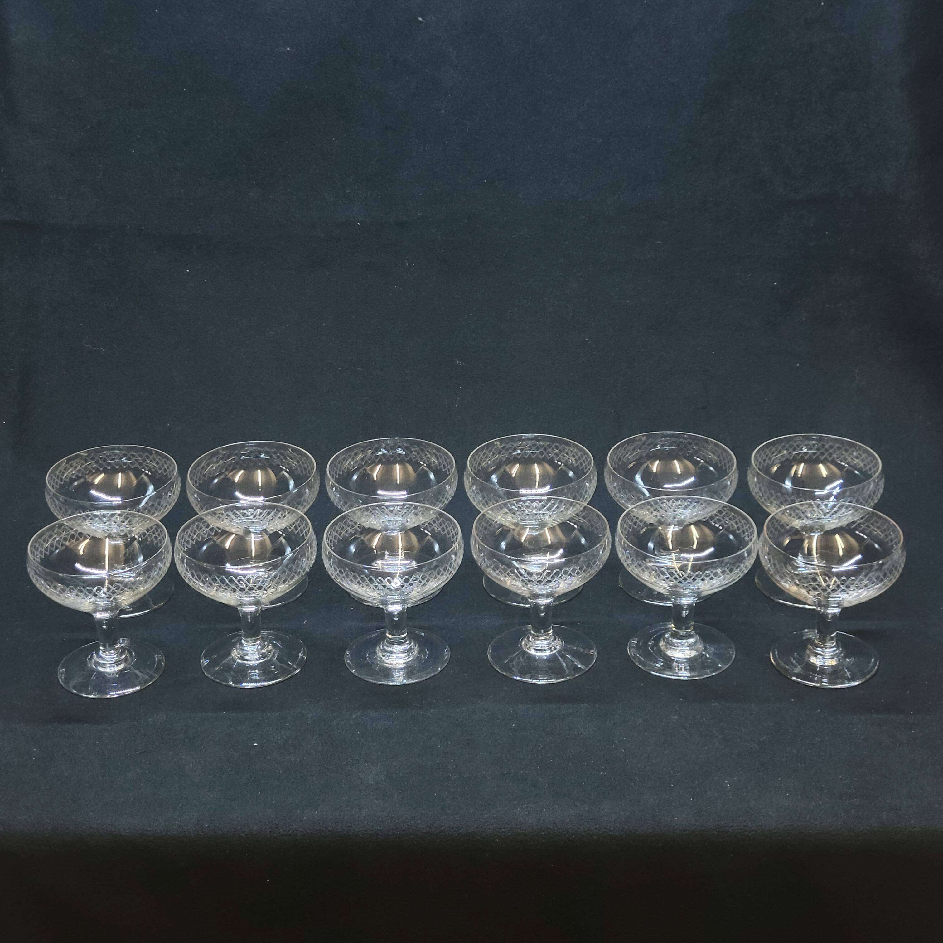 12 old champagne glasses in blown and engraved glass