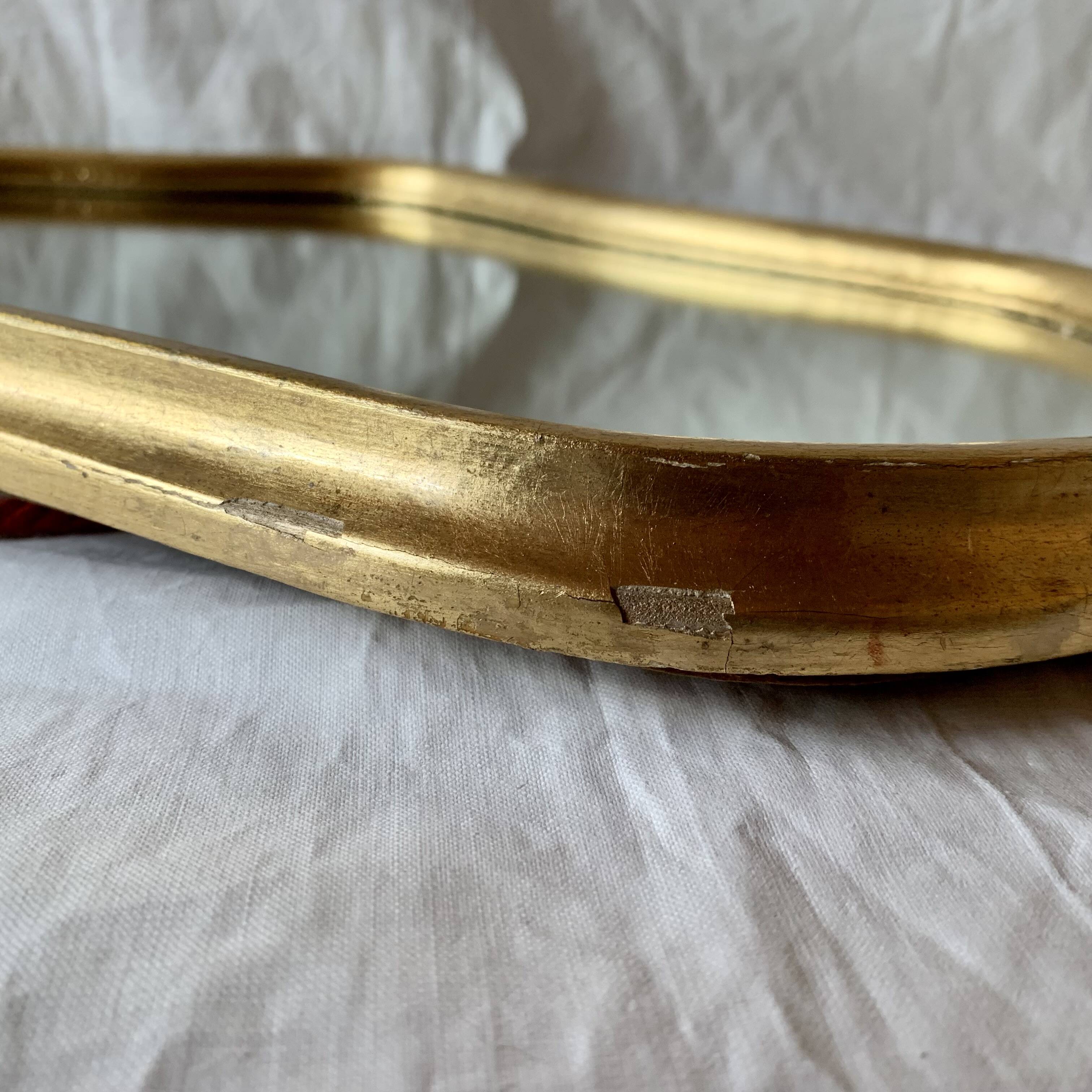 Antique beveled wall mirror in gilded solid wood