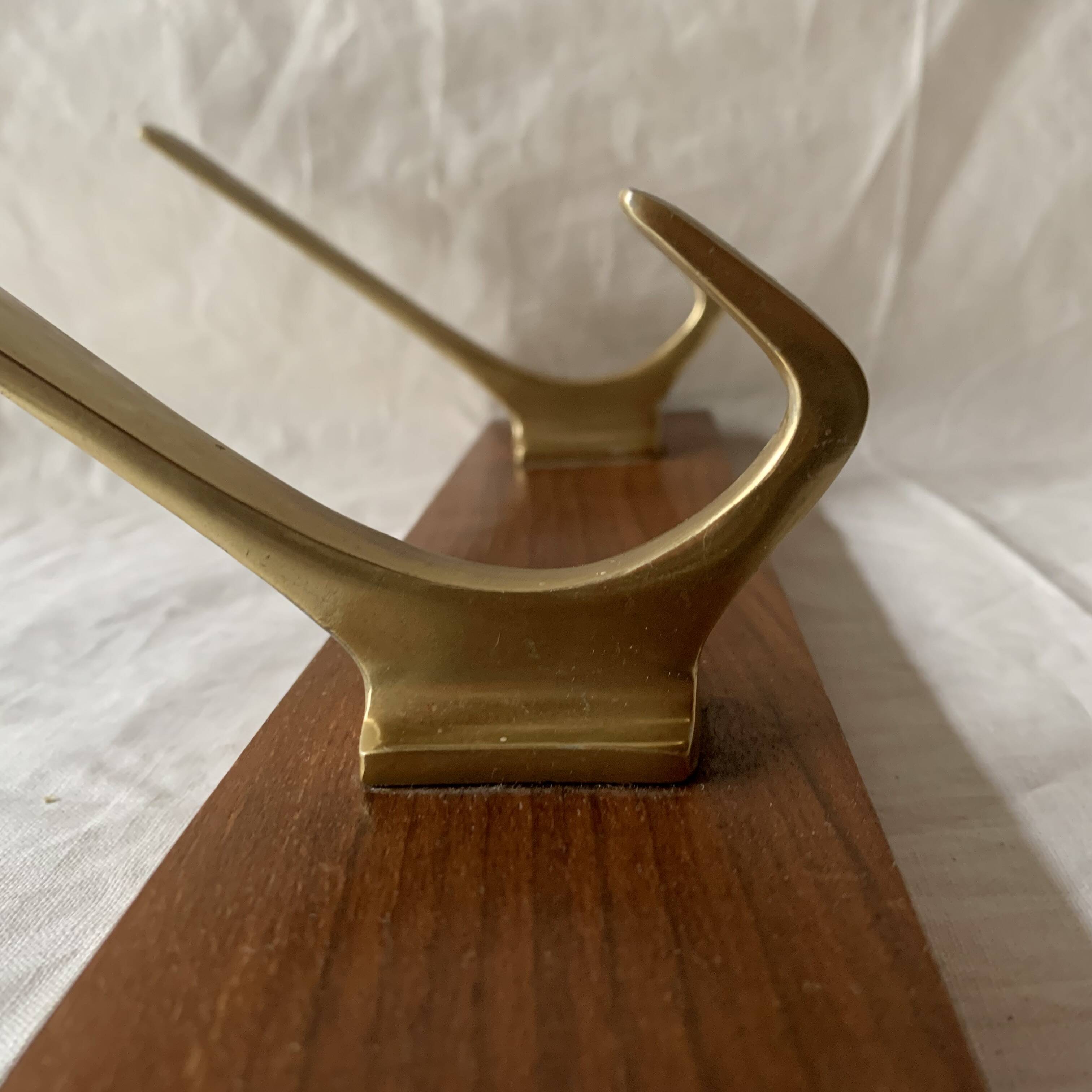 Vintage wooden wall-mounted coat rack with 3 golden cast aluminum hooks