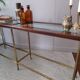 Glass and brass console table