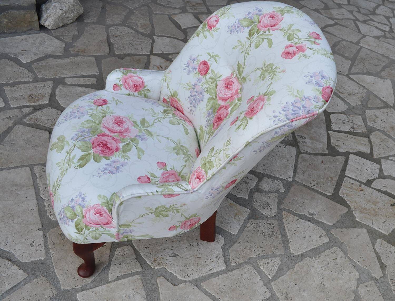 1950s vintage armchair in white and pink floral fabric, mahogany wooden legs.