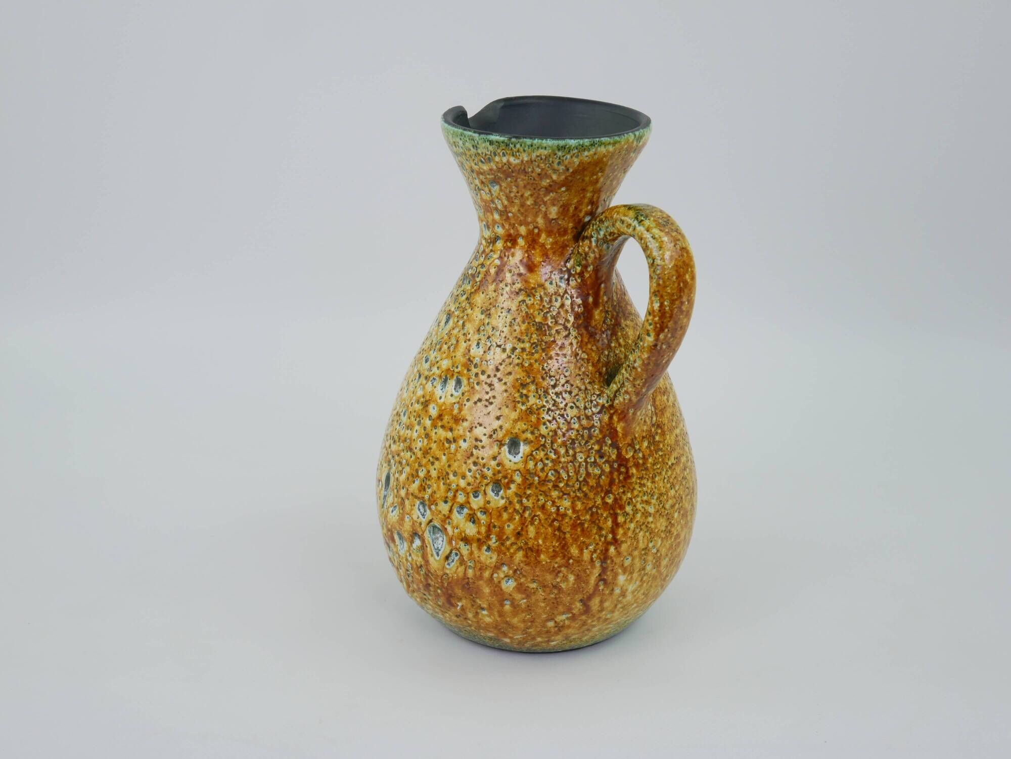 Large yellow ceramic pitcher in the Accolay style