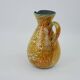 Large yellow ceramic pitcher in the Accolay style