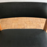 Chair in light teak and black skaï from the 1960s