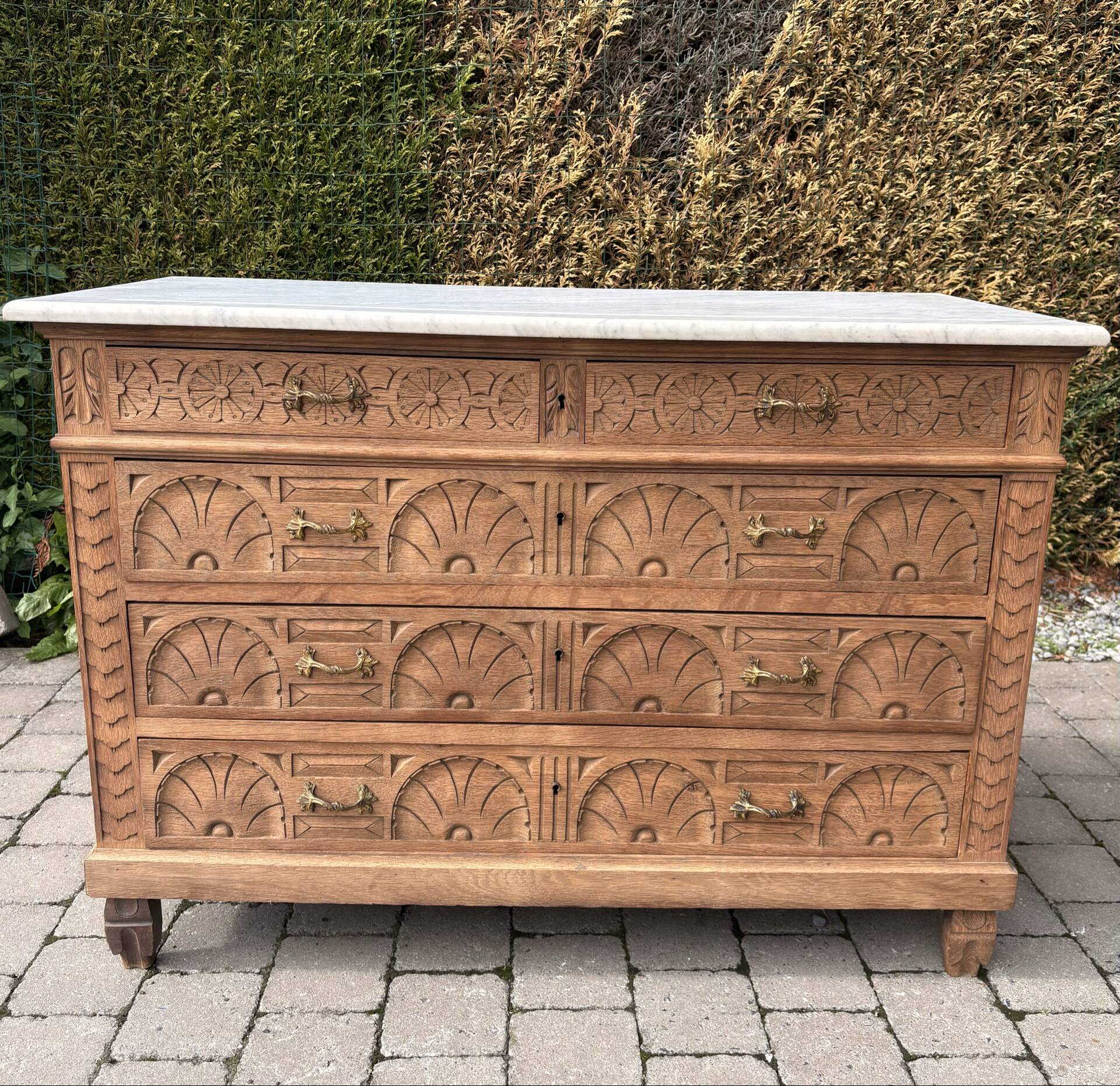 Solid oak chest of drawers with a marble top and original mirror.