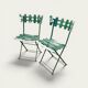 Pair of original patinated folding Parisian bistro chairs.