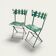 Pair of original patina folding Parisian bistro chairs.