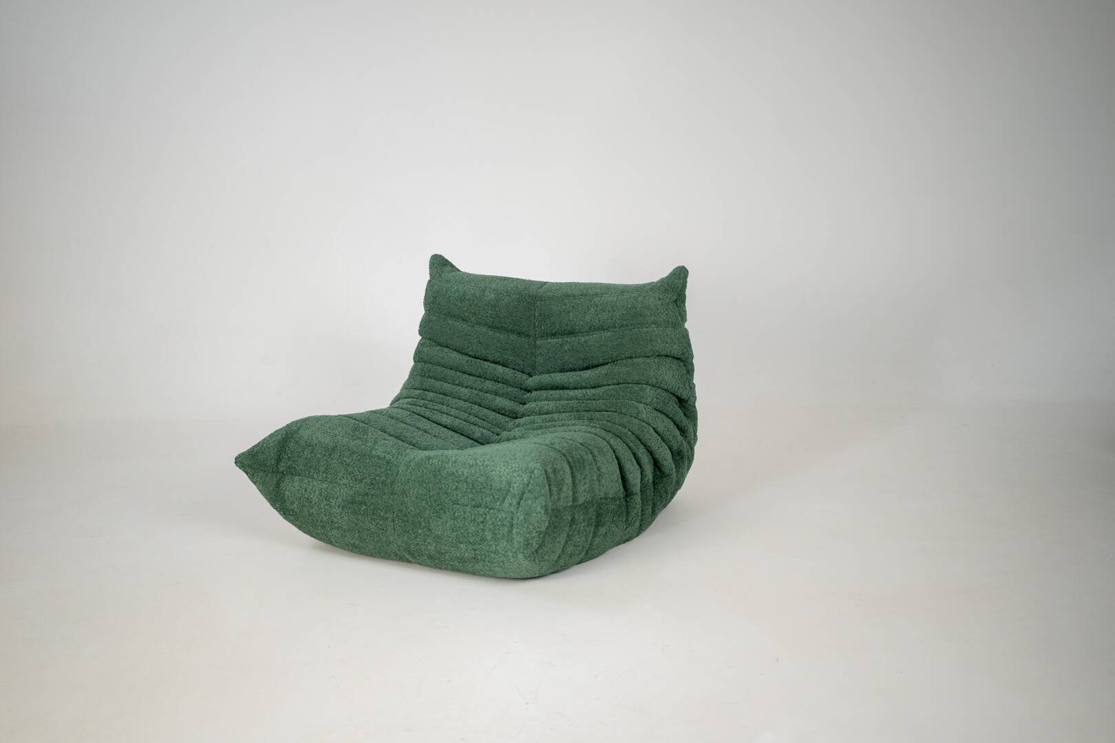 Togo set of armchair and pouf in emerald bucle