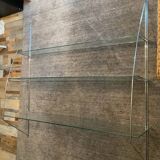 Half-moon design shelf in chromed metal and glass